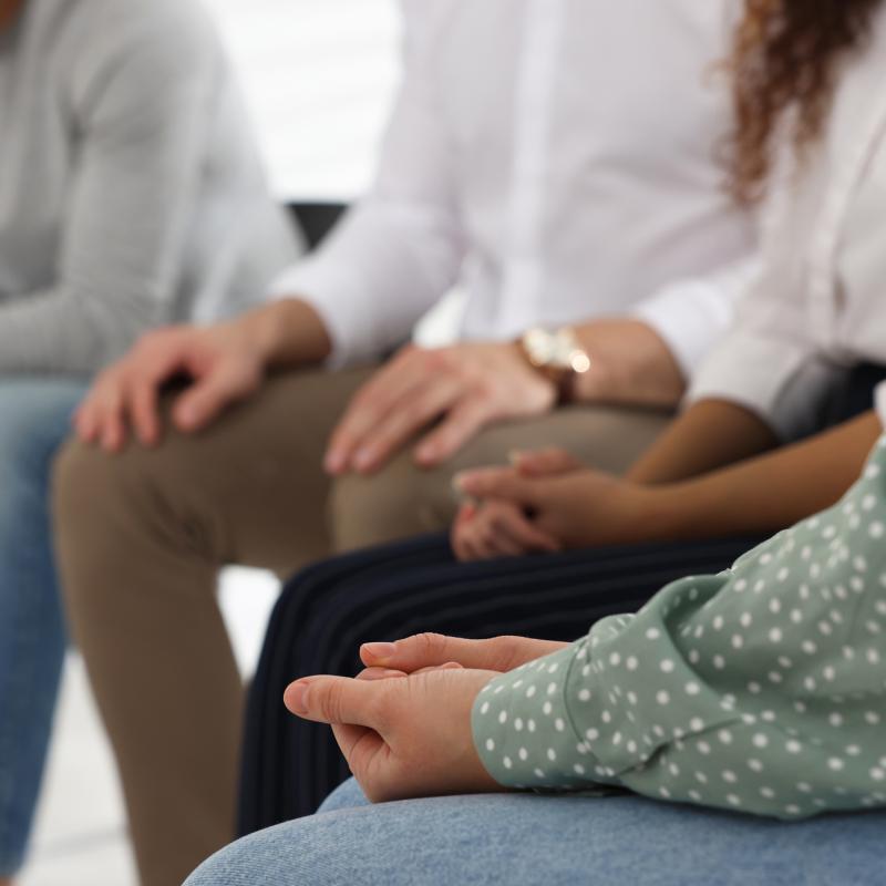 Group of people sit in a circle for time of discernment and prayer